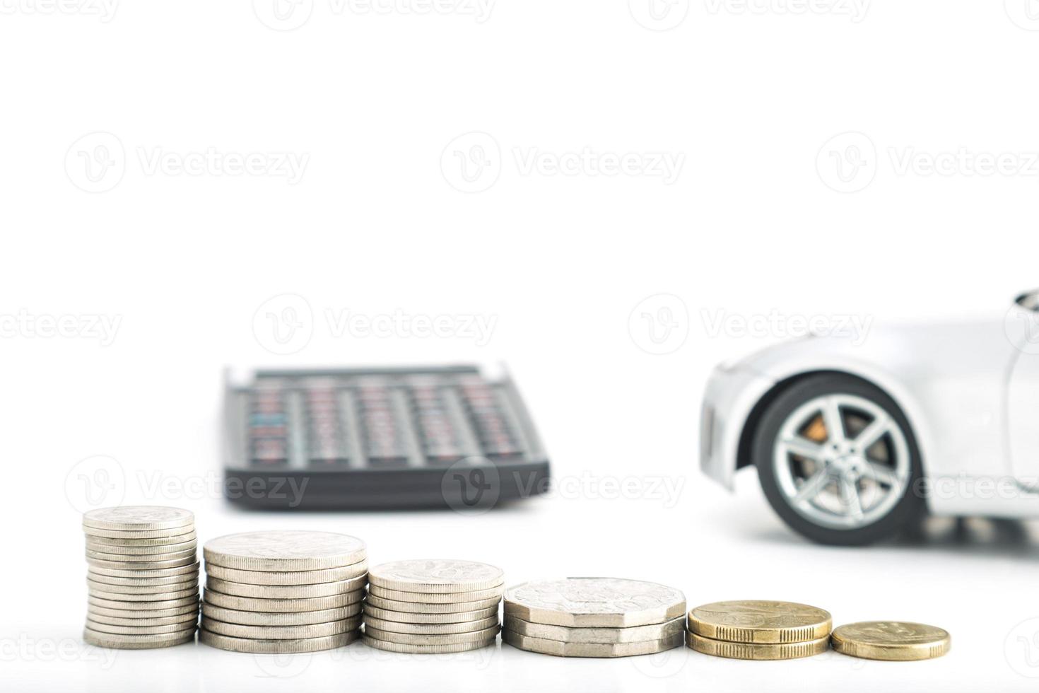 Coins with car and calculator photo