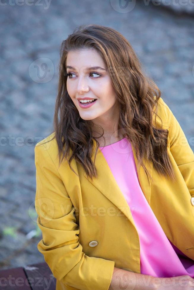 Beautiful white woman in casual clothes on the street photo