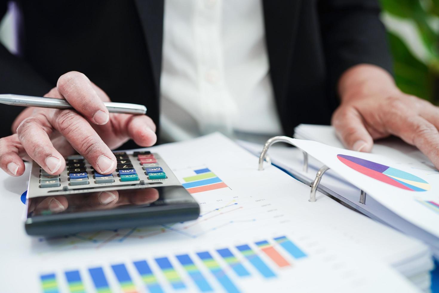 Business woman working and analysis with statistic graph in office. photo