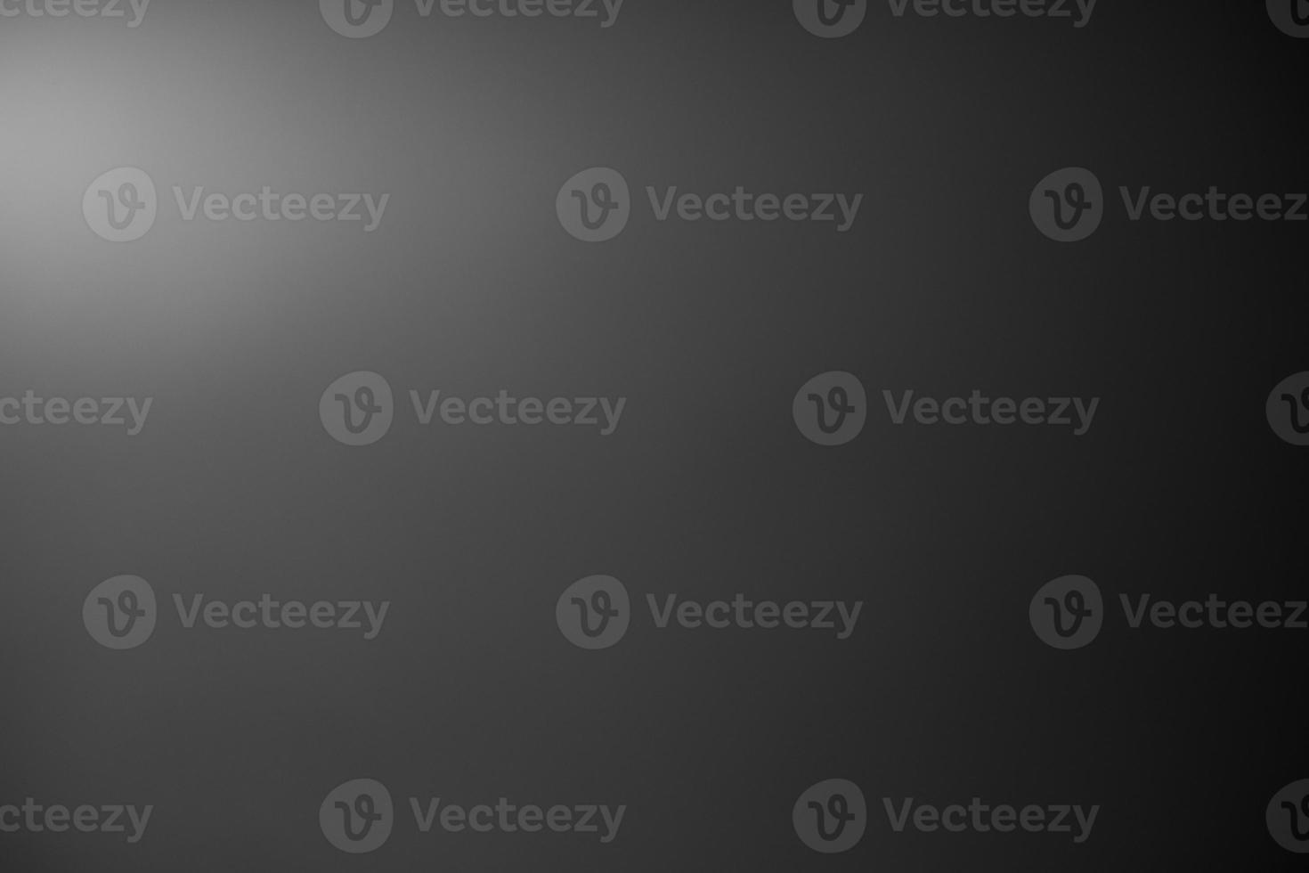 Dark black and gray blurred background has a little abstract light. soft background for wallpaper,design,graphic and presentation photo
