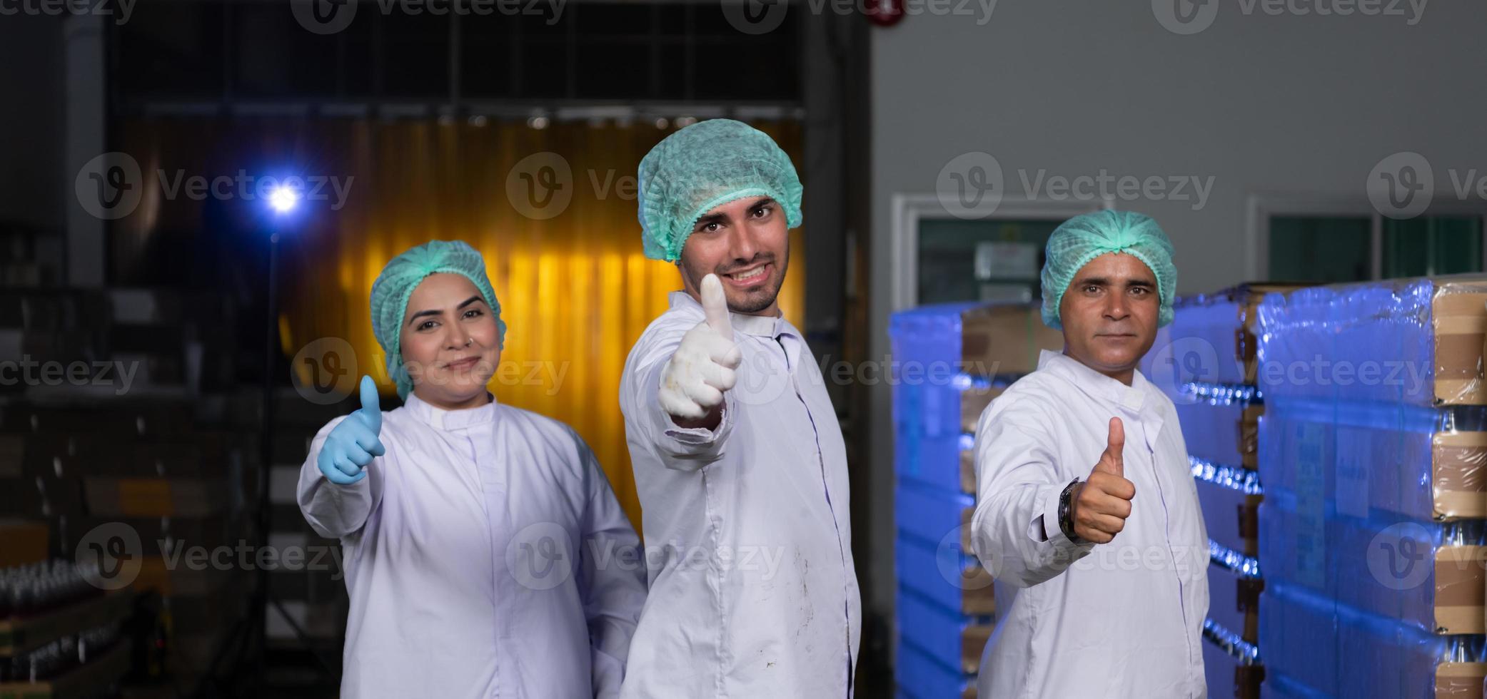 A team of scientists at the fruit juice factory Get ready for the day's work to check the quality of the products photo