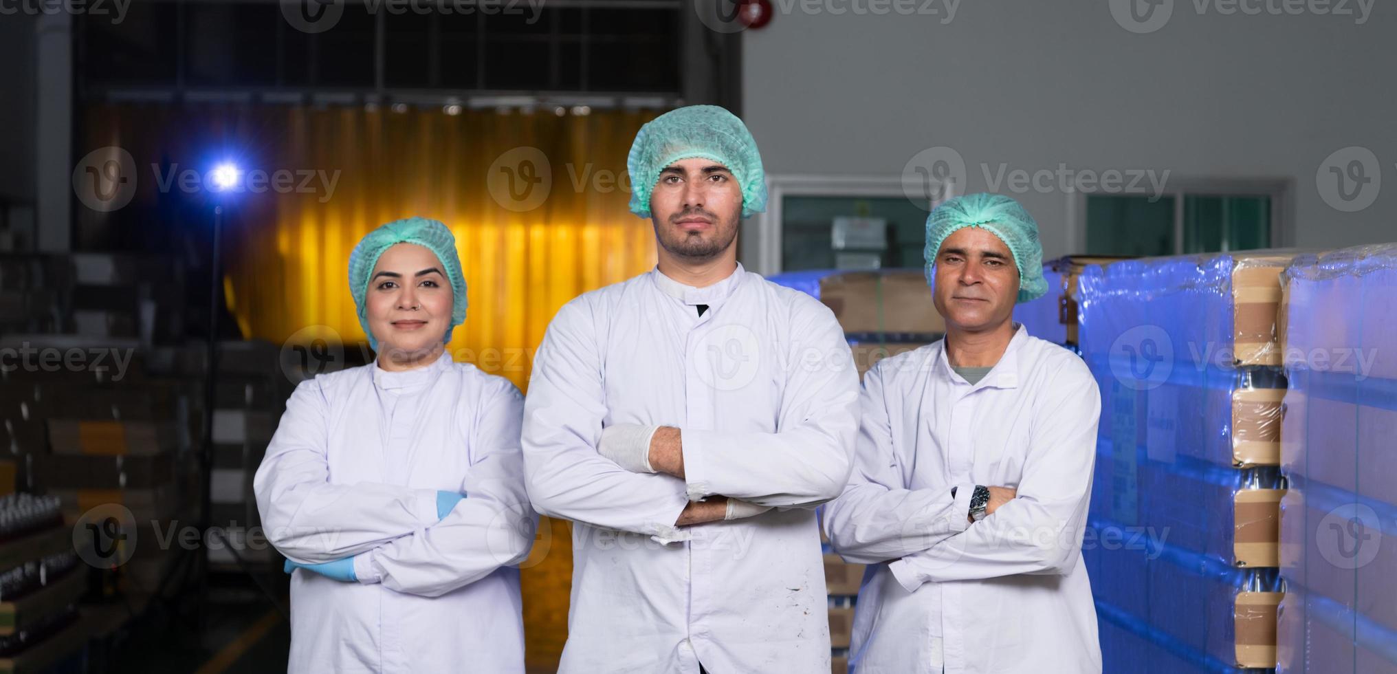 A team of scientists at the fruit juice factory Get ready for the day's work to check the quality of the products photo