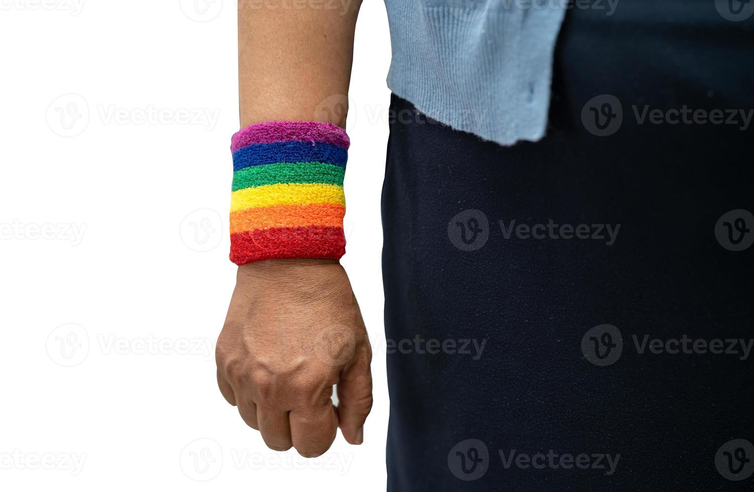 Asian lady wearing rainbow flag wristbands isolated on white background with clipping path, symbol of LGBT social of gay, lesbian, bisexual, human rights. photo