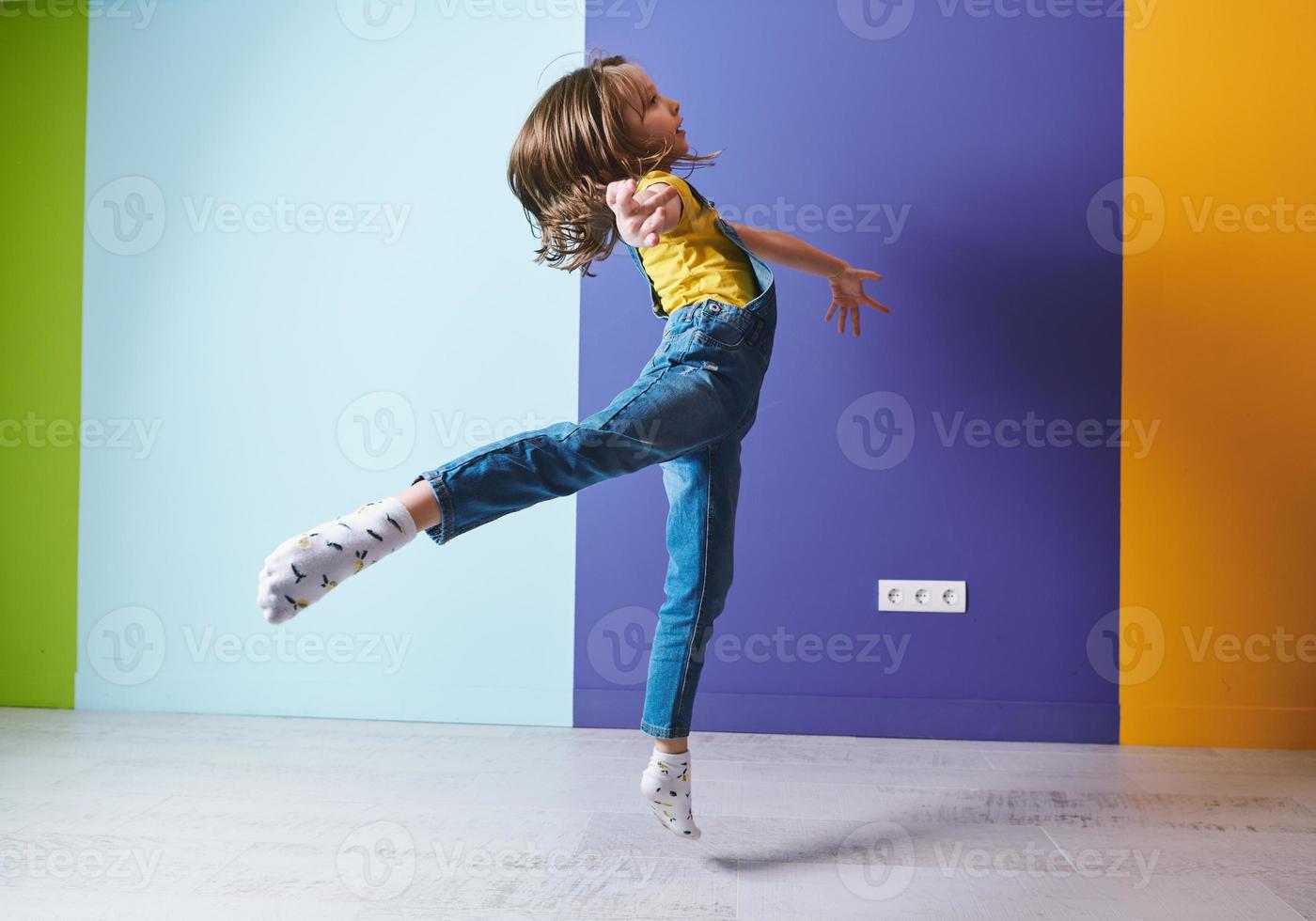 Cute little girl dancing at home photo