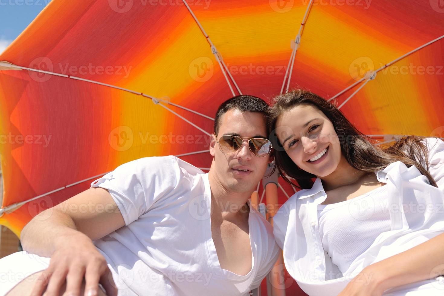 happy couple have fun on the beach photo