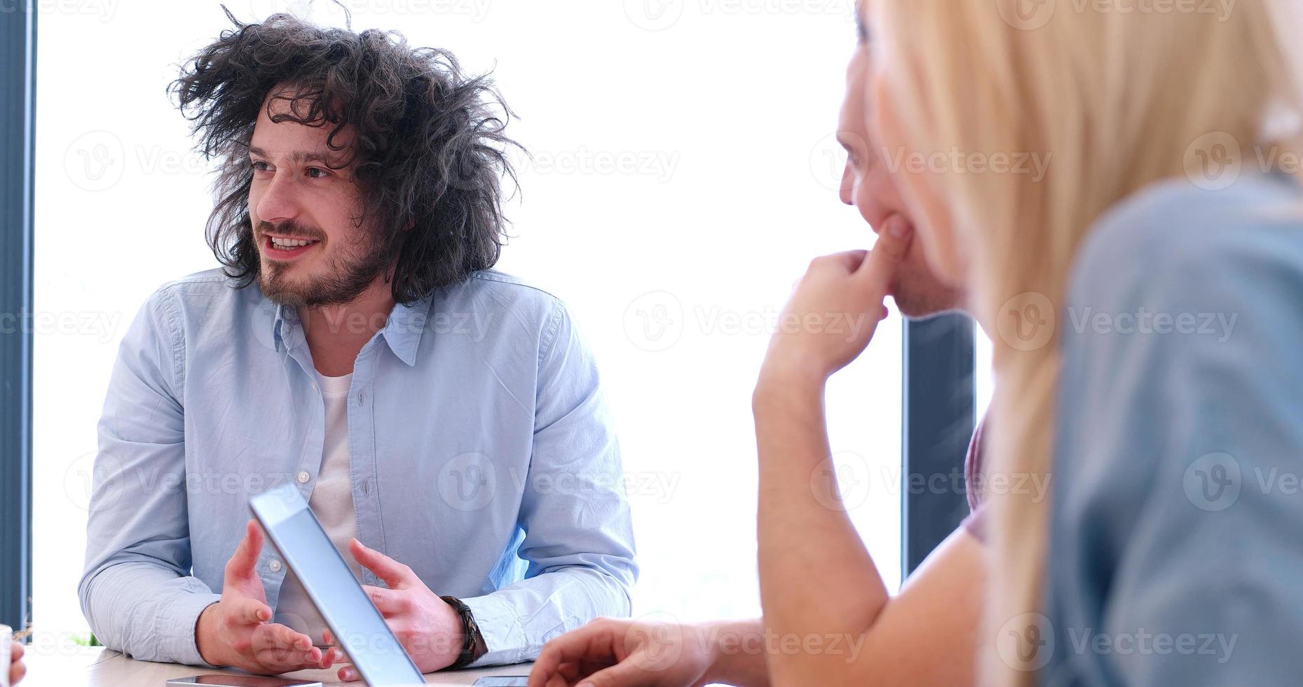 Startup Business Team At A Meeting at modern office building photo