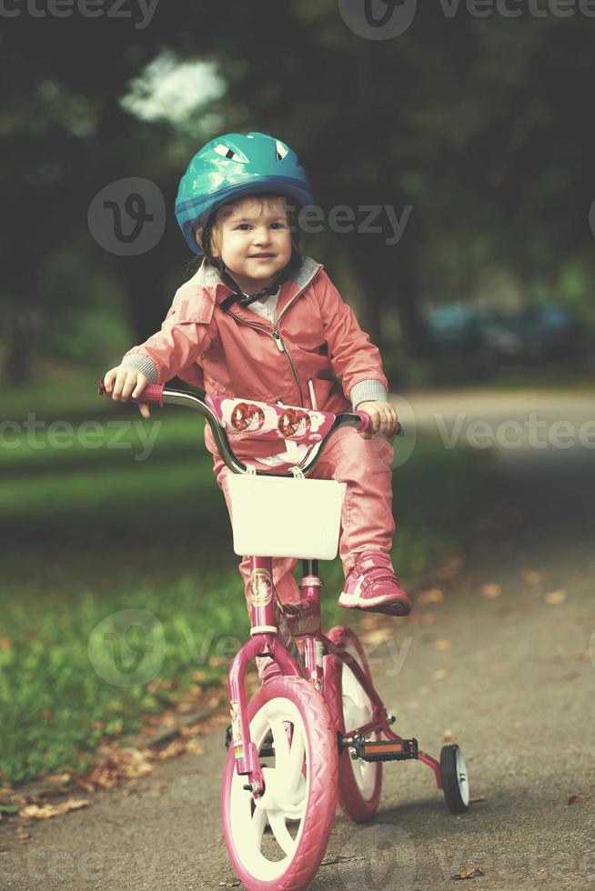 little girl with bicycle photo