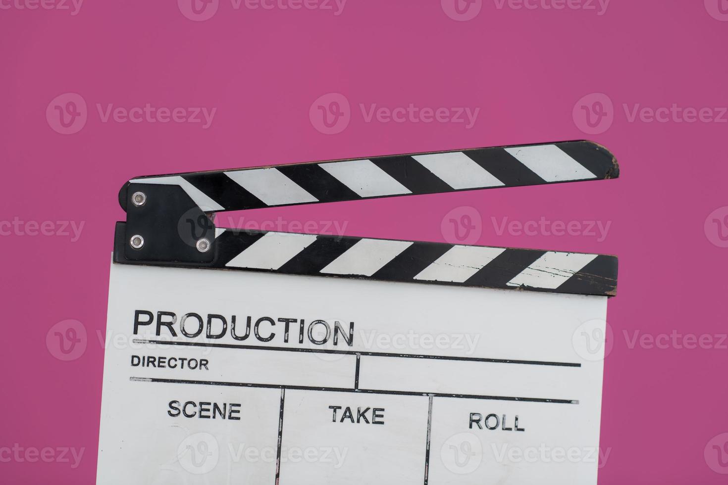 movie clapper on pink background photo