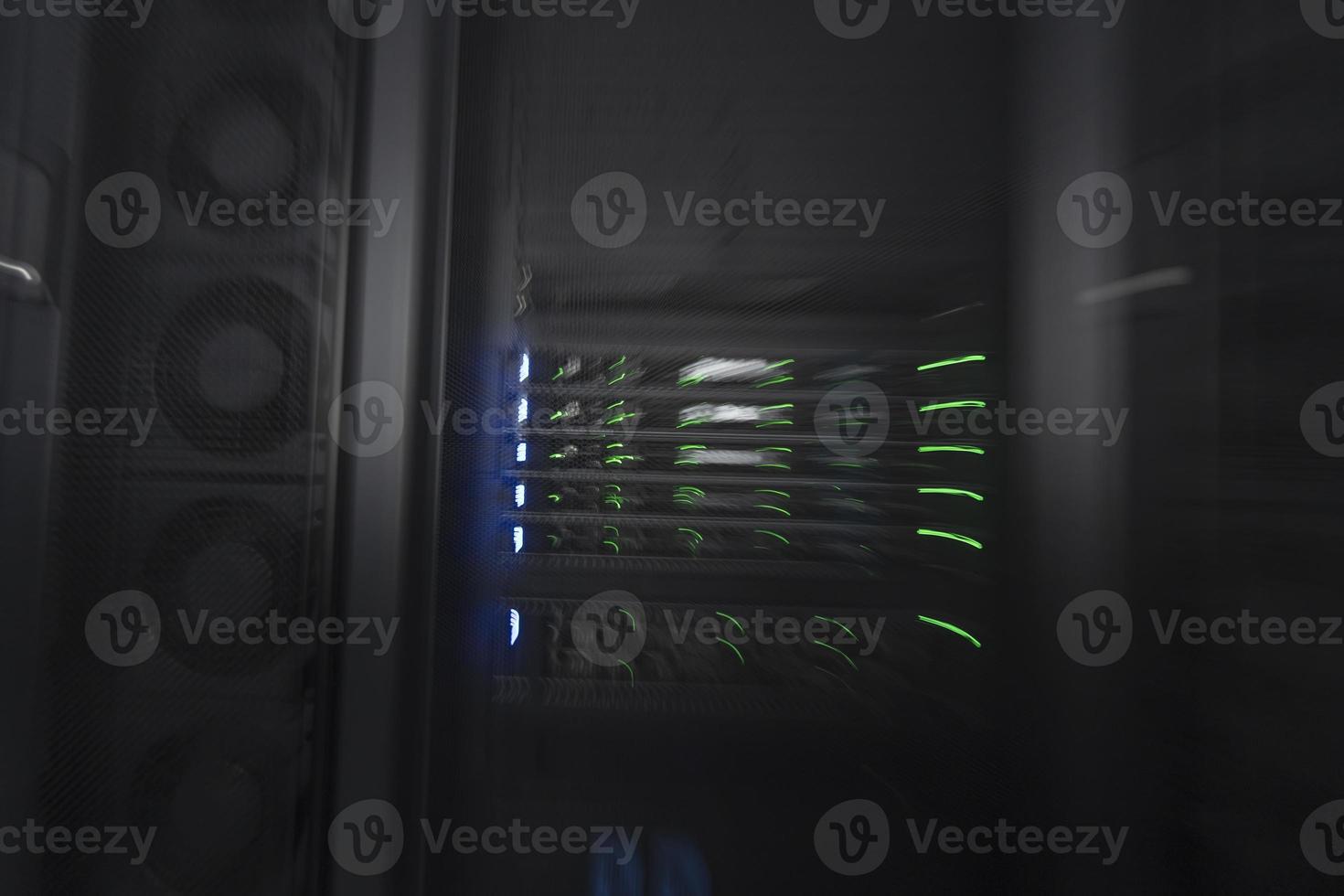 server room or data center supercomputer technology equipment, abstract close up of a server rack with motion blur. photo