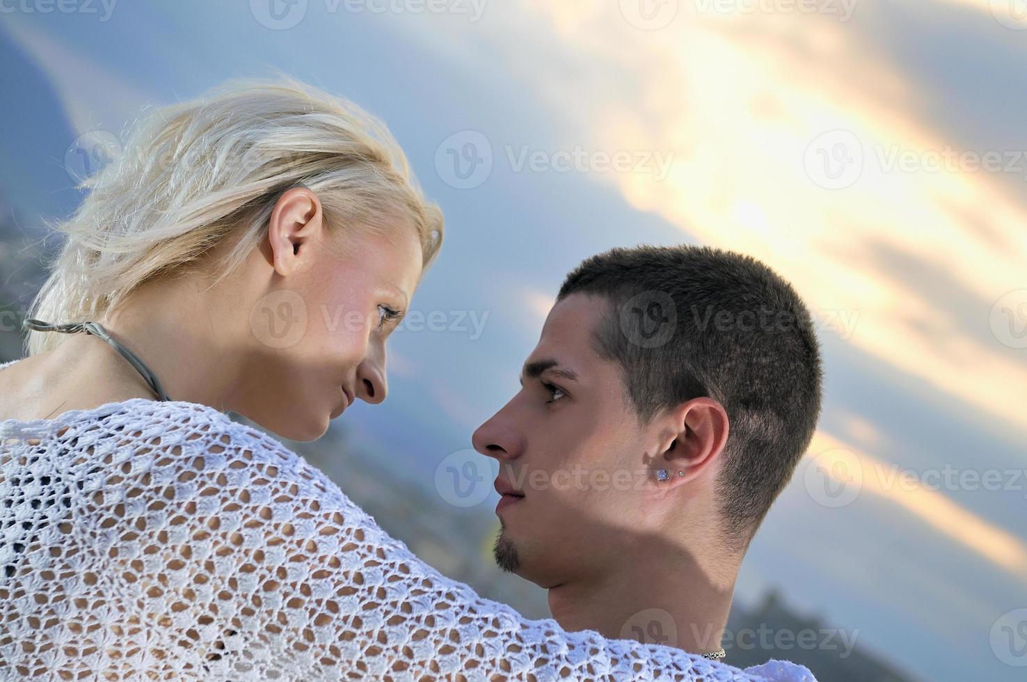romantic urban couple dancing on top of  bulding photo