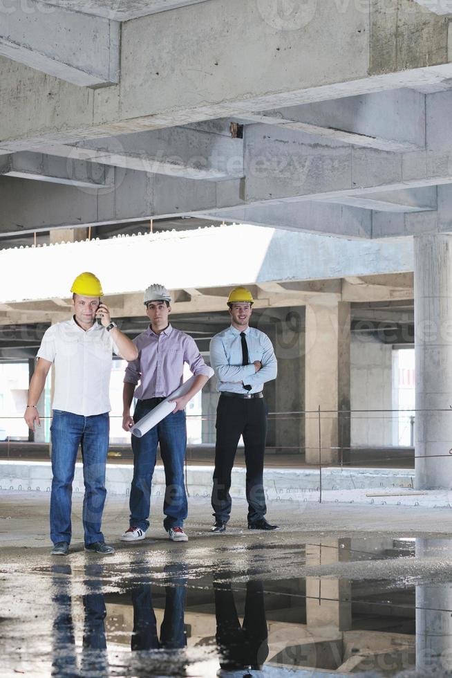 Team of architects on construciton site photo