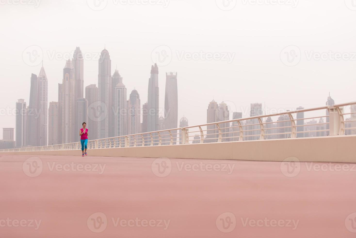 woman running on the promenade photo