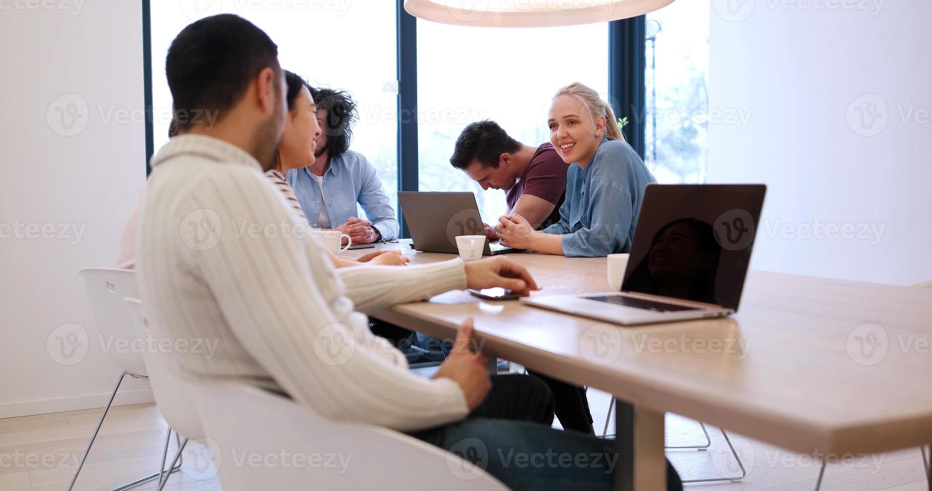 Startup Business Team At A Meeting at modern office building photo