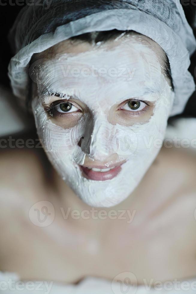 woman with facial mask in cosmetic studio photo