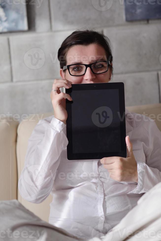woman using tablet pc at home photo