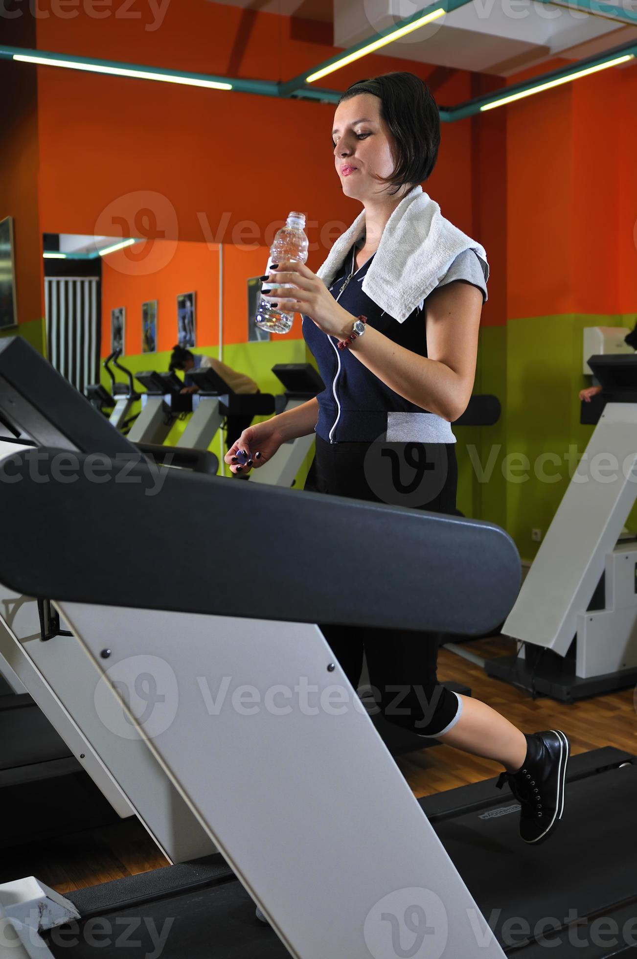 Young woman drinking water while working out 11256459 Stock Photo at