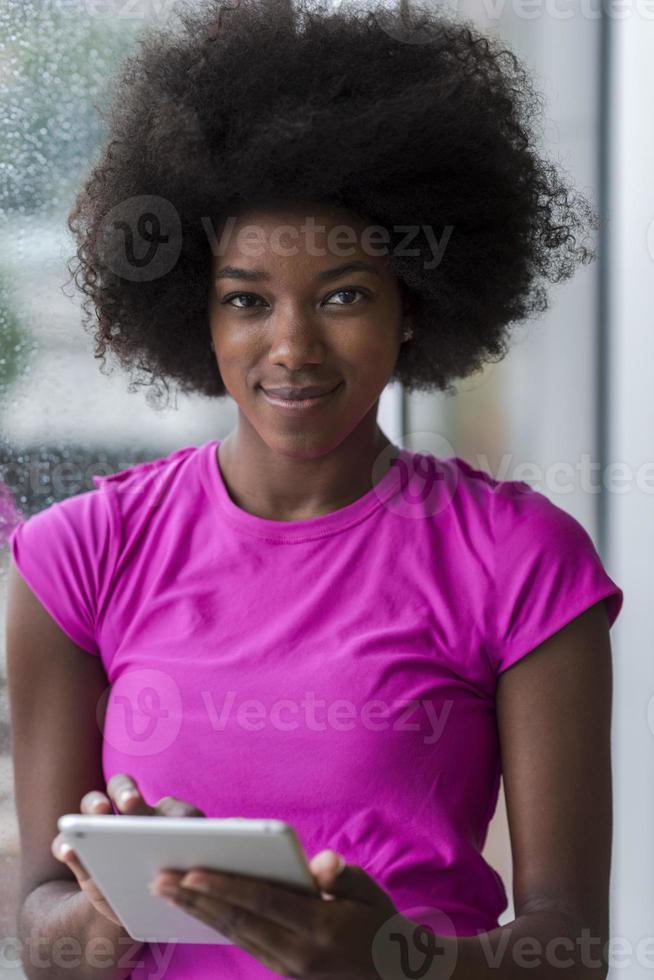 african american woman using tablet photo