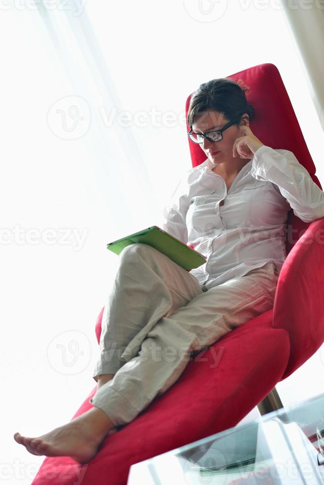 woman using tablet pc at home photo