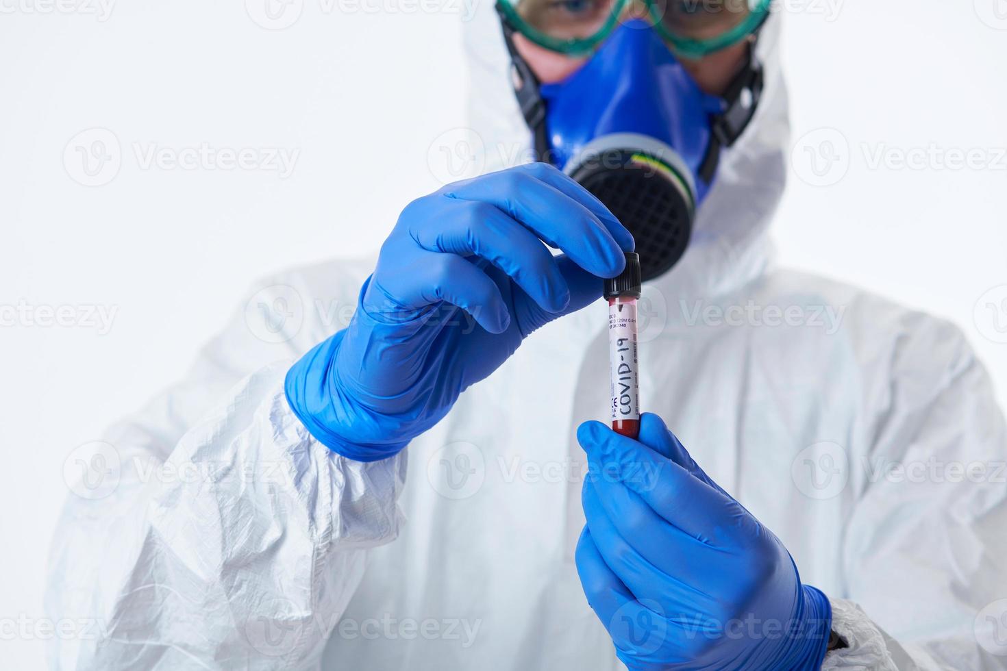 Coronavirus, Doctor holding positive covid-19 virus Blood Sample tube white background photo