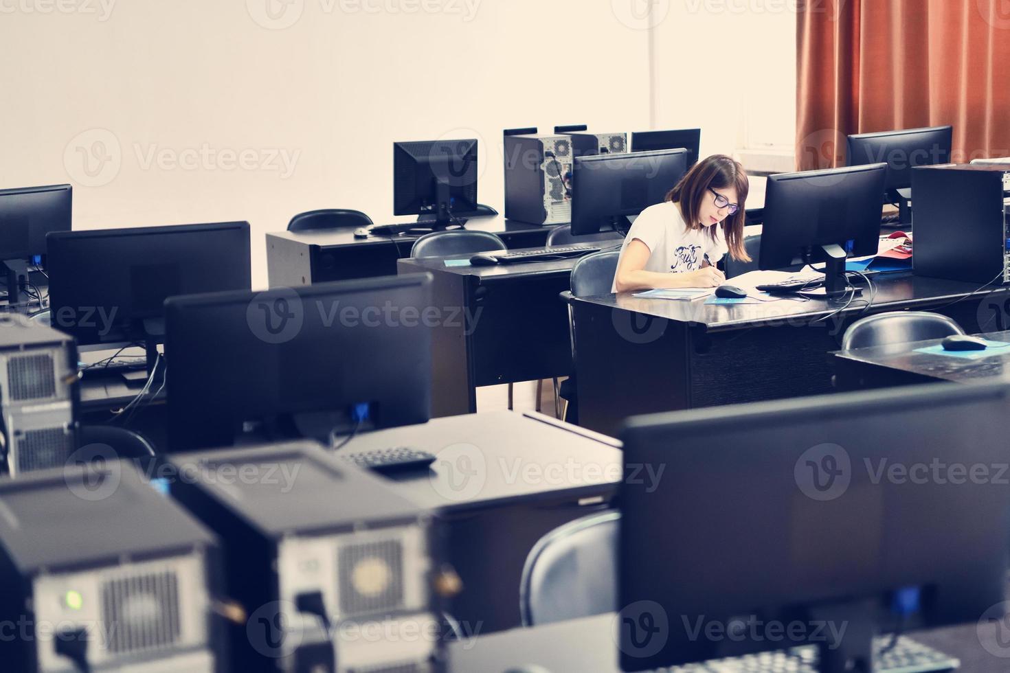 one student in computers classroom photo