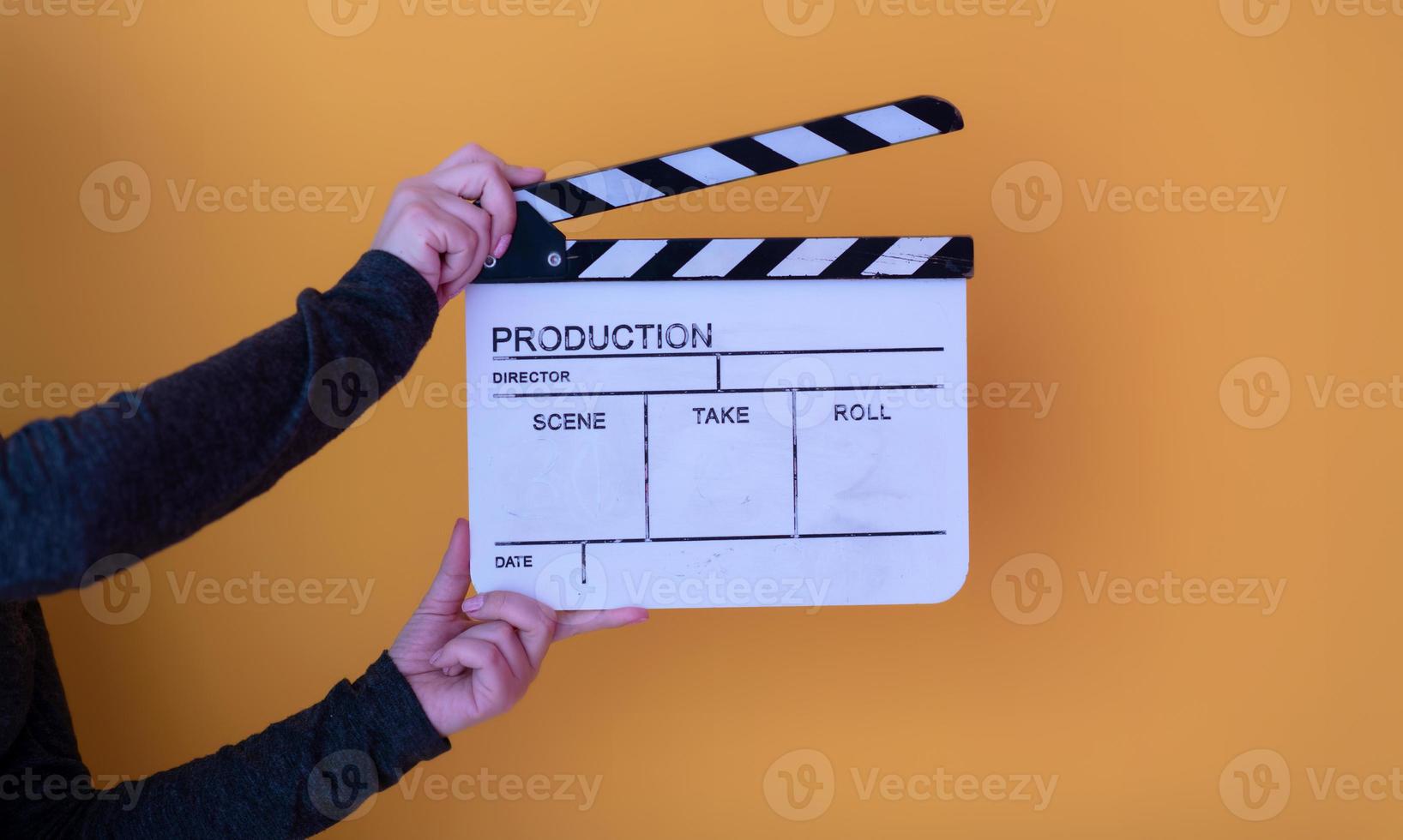 movie clapper on yellow background photo