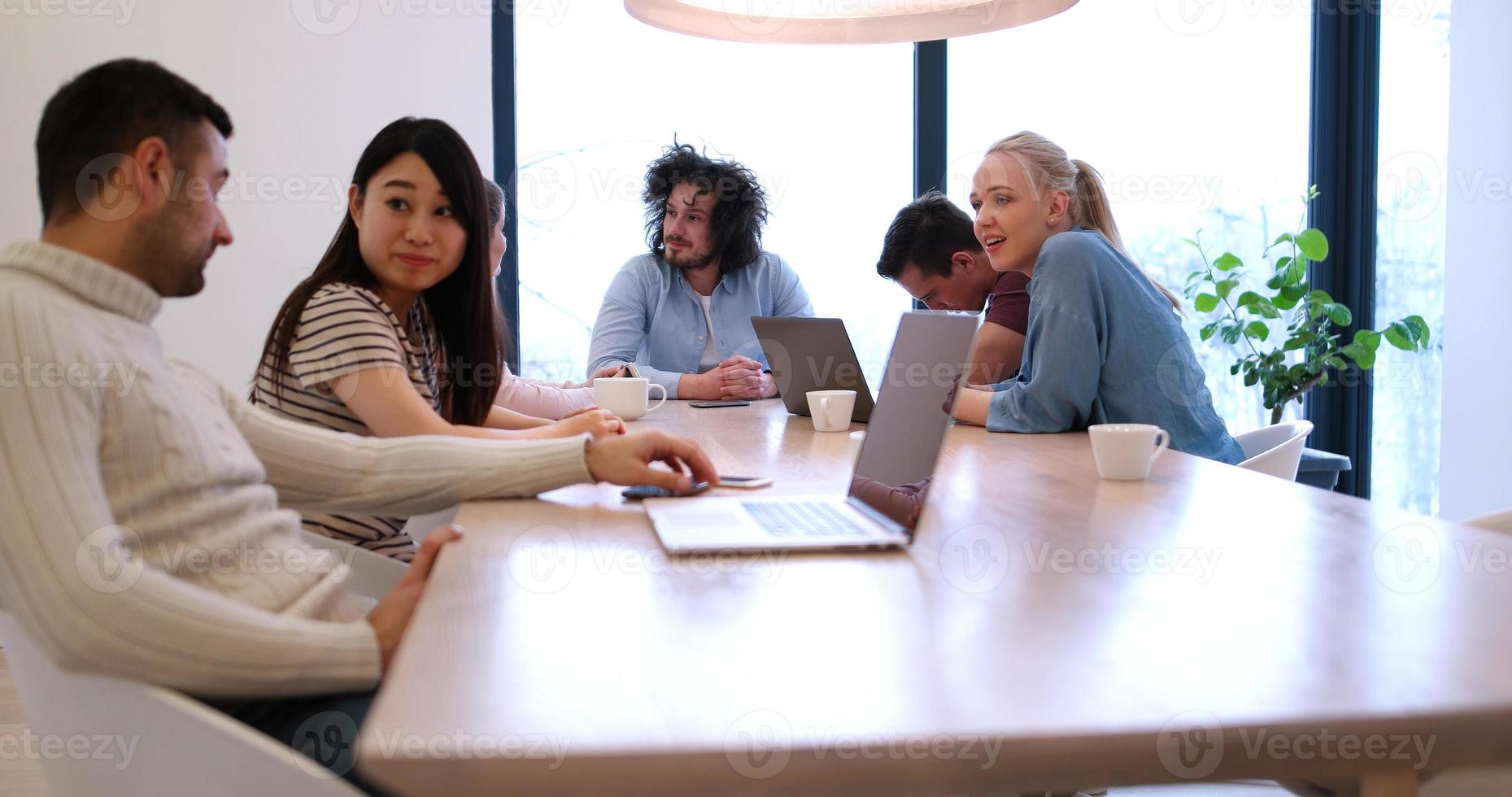 Startup Business Team At A Meeting at modern office building photo