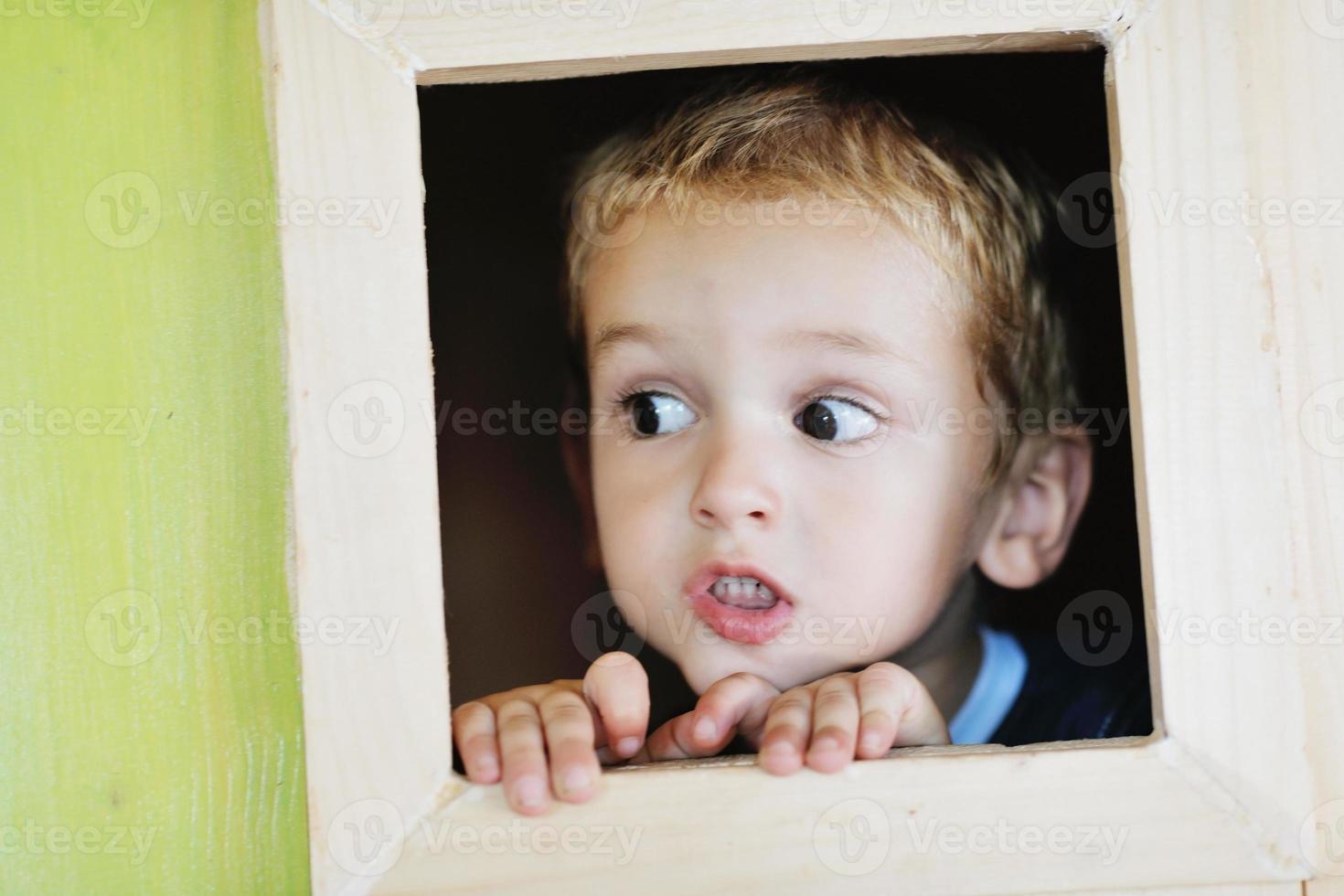 happy child in a window photo