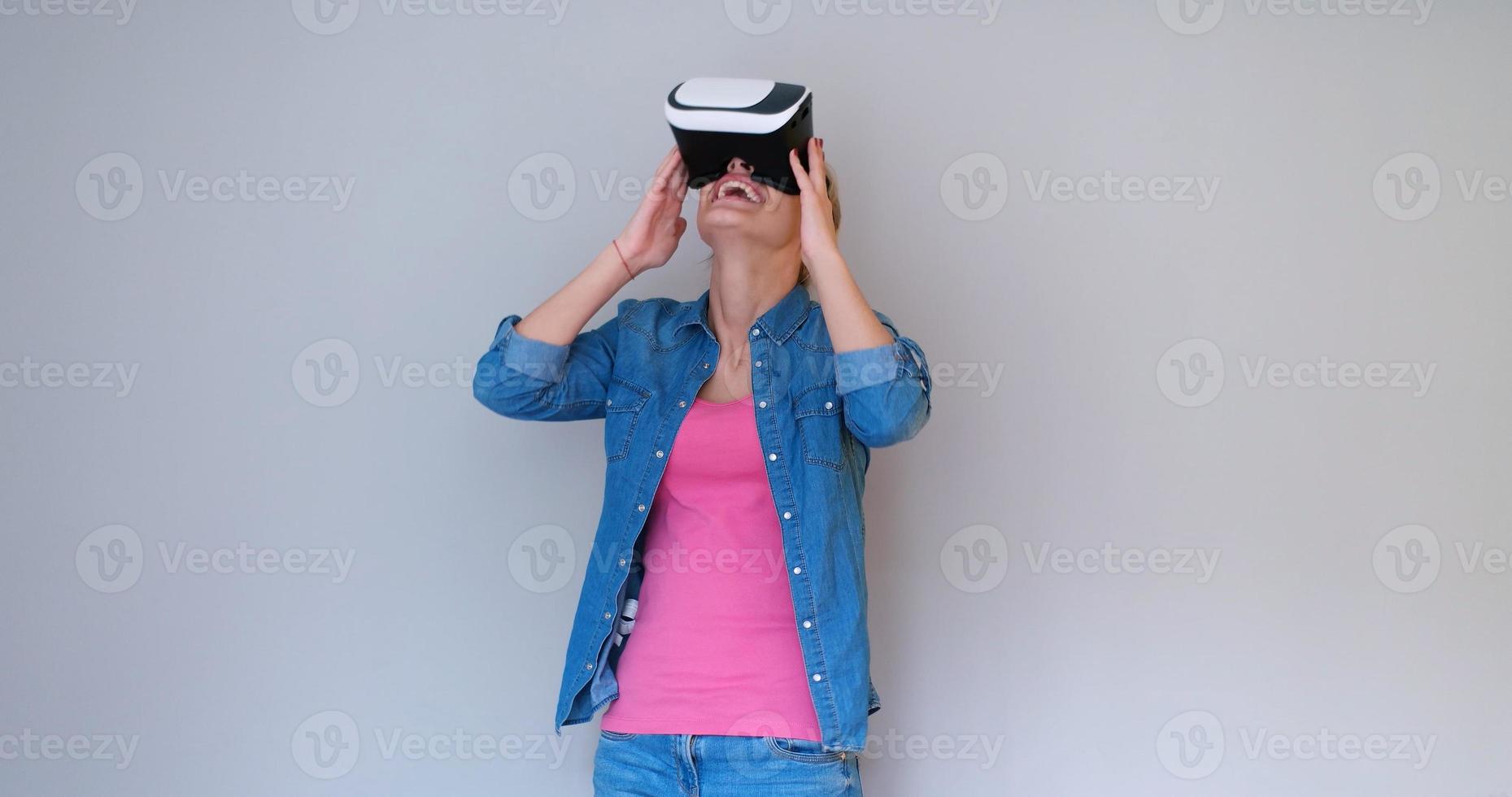 girl using VR headset glasses of virtual reality photo