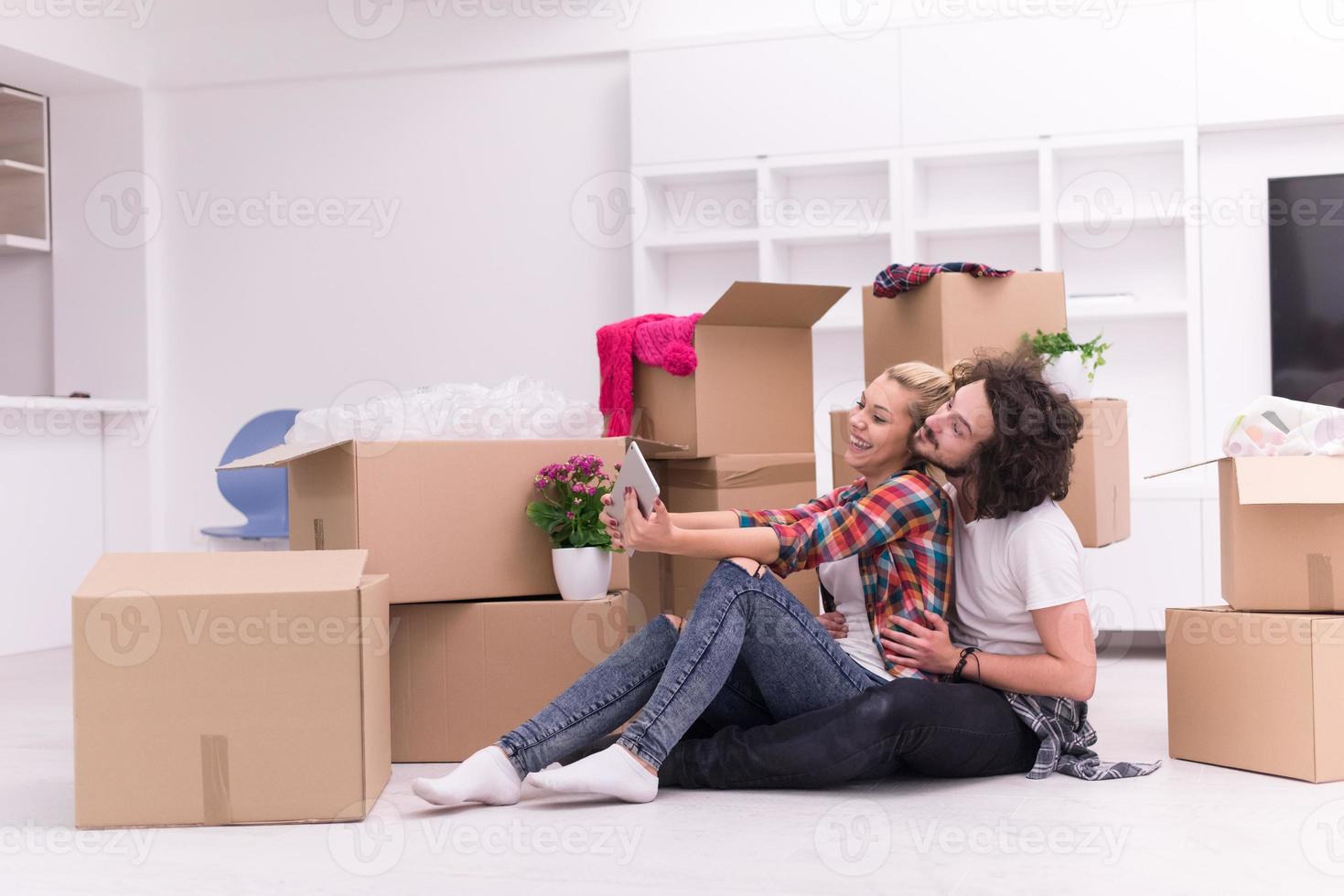 young couple moving  in new house photo