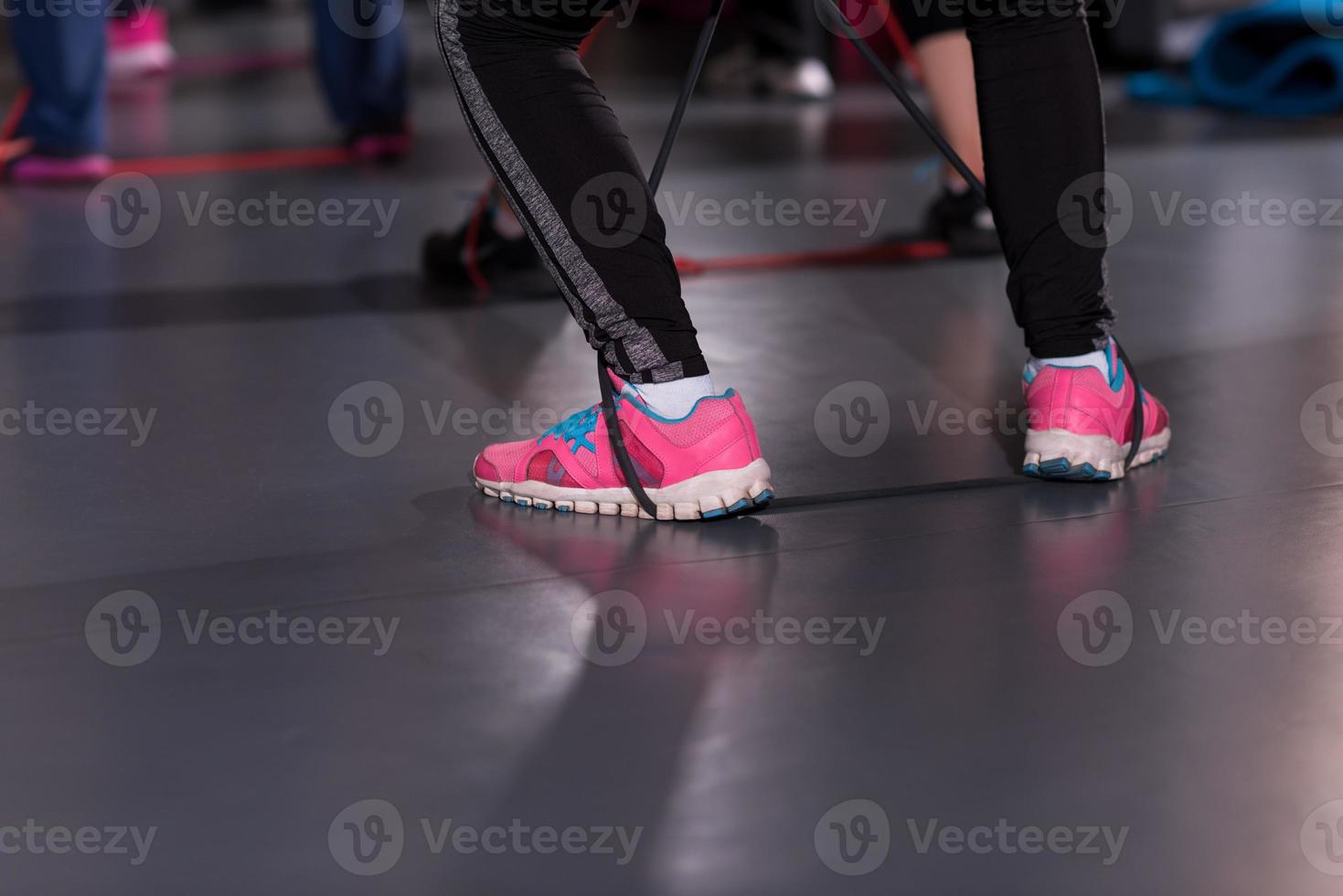 sporty women exercising with a rubber bands photo