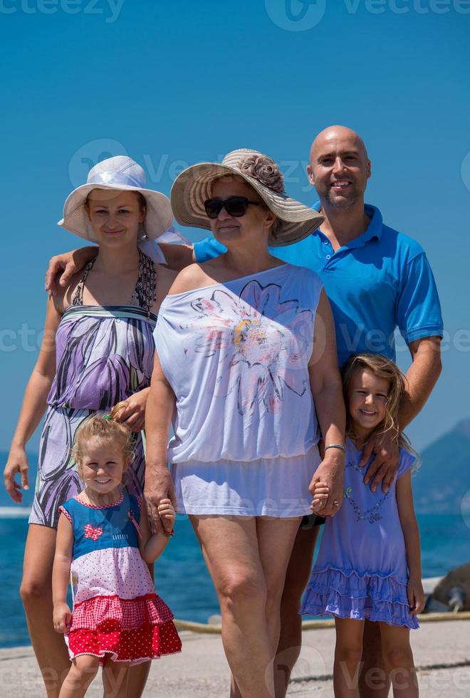 Portrait of happy multi generation family by the sea photo