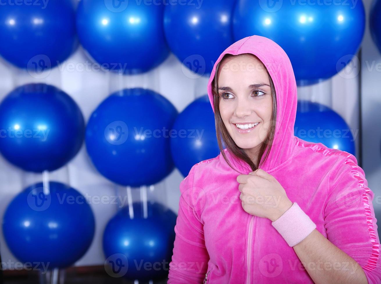 young woman exercising with pilates ball photo