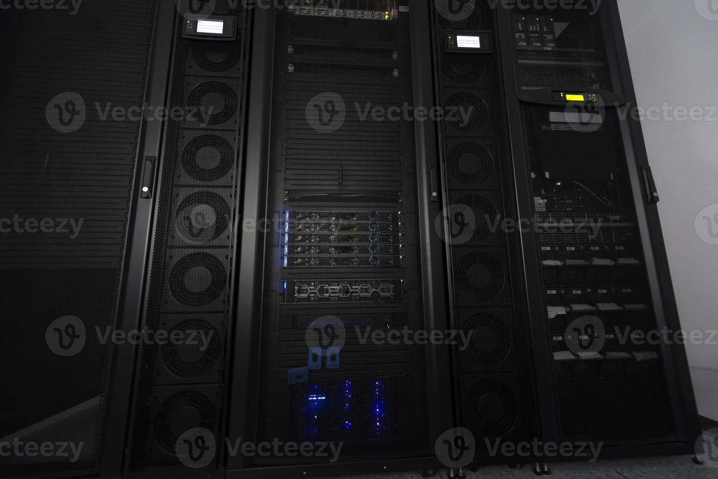 Data Center With Multiple Rows of Fully Operational Server Racks. Modern Telecommunications, Cloud Computing, Artificial Intelligence, Database, Supercomputer Technology Concept. photo