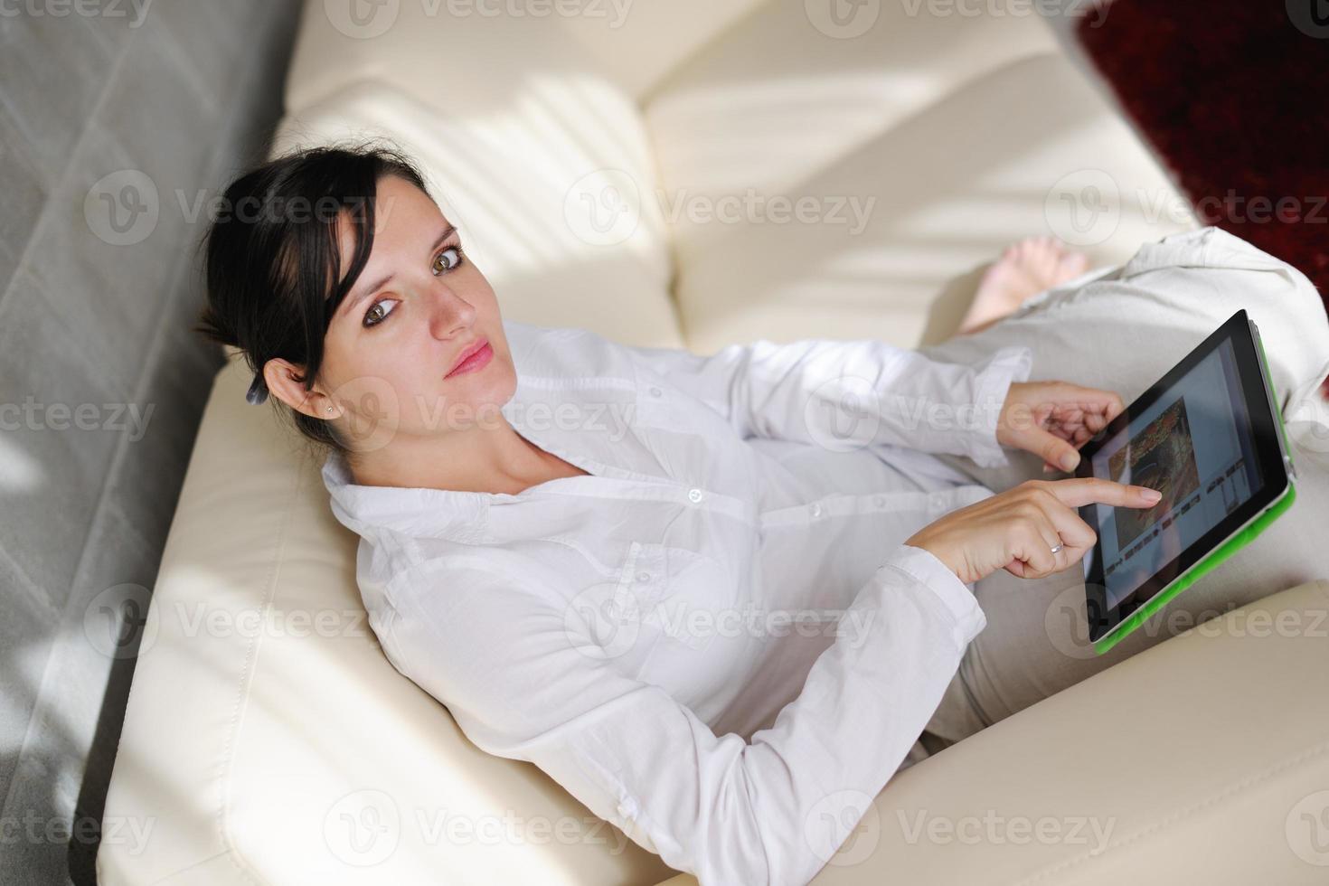 woman using tablet pc at home photo