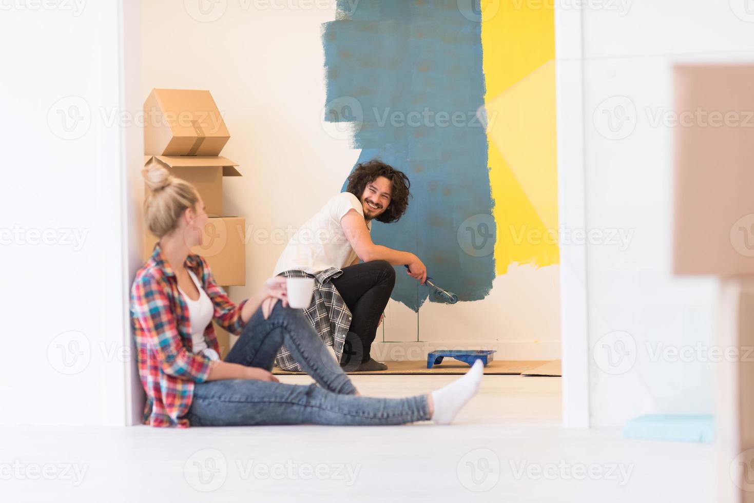 young couple doing home renovations photo