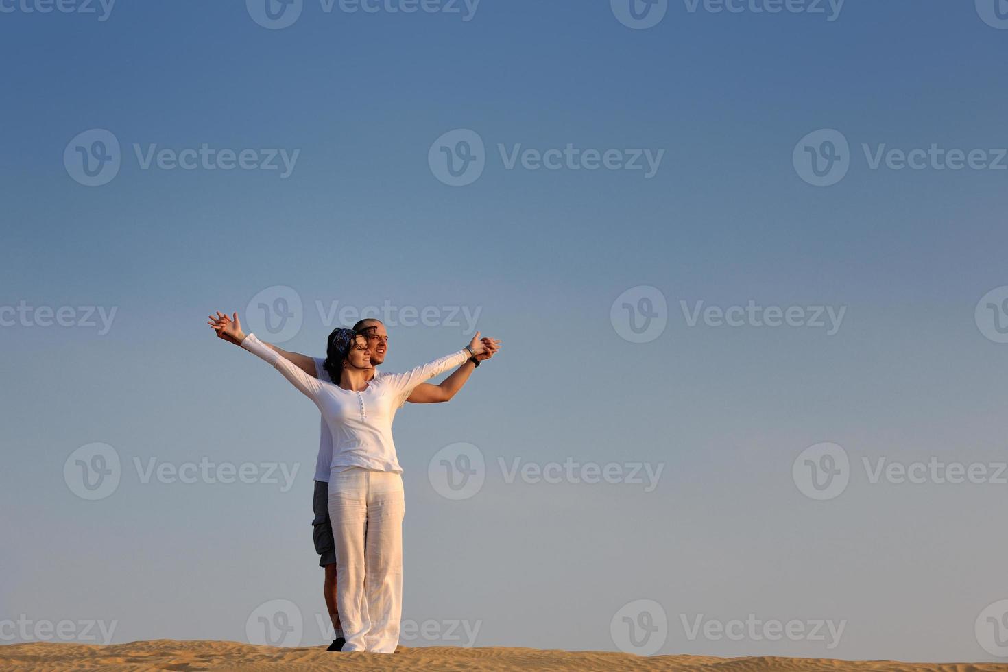 couple enjoying the sunset photo