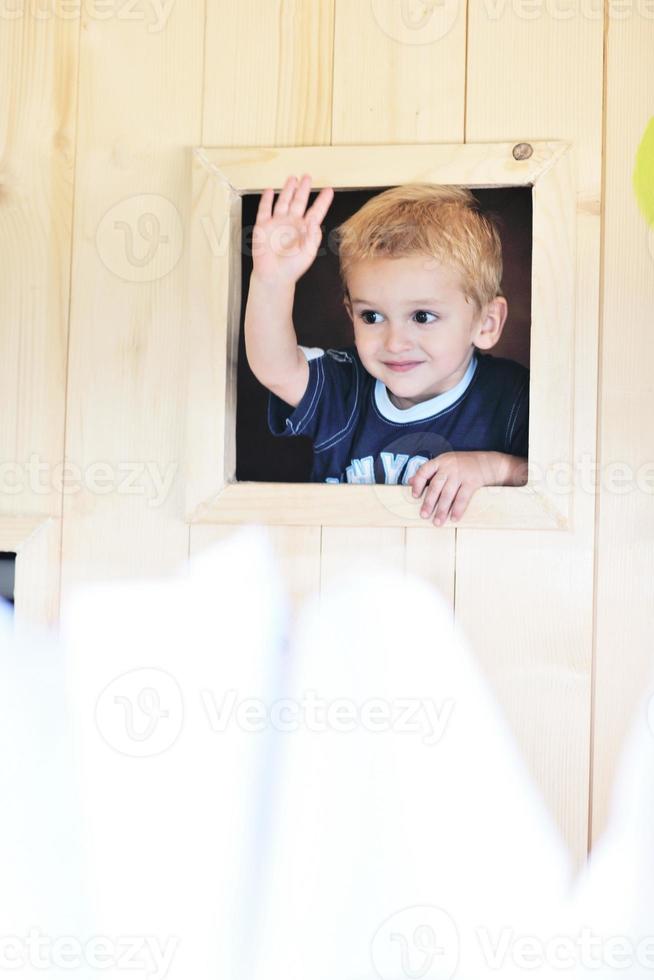 happy child in a window photo