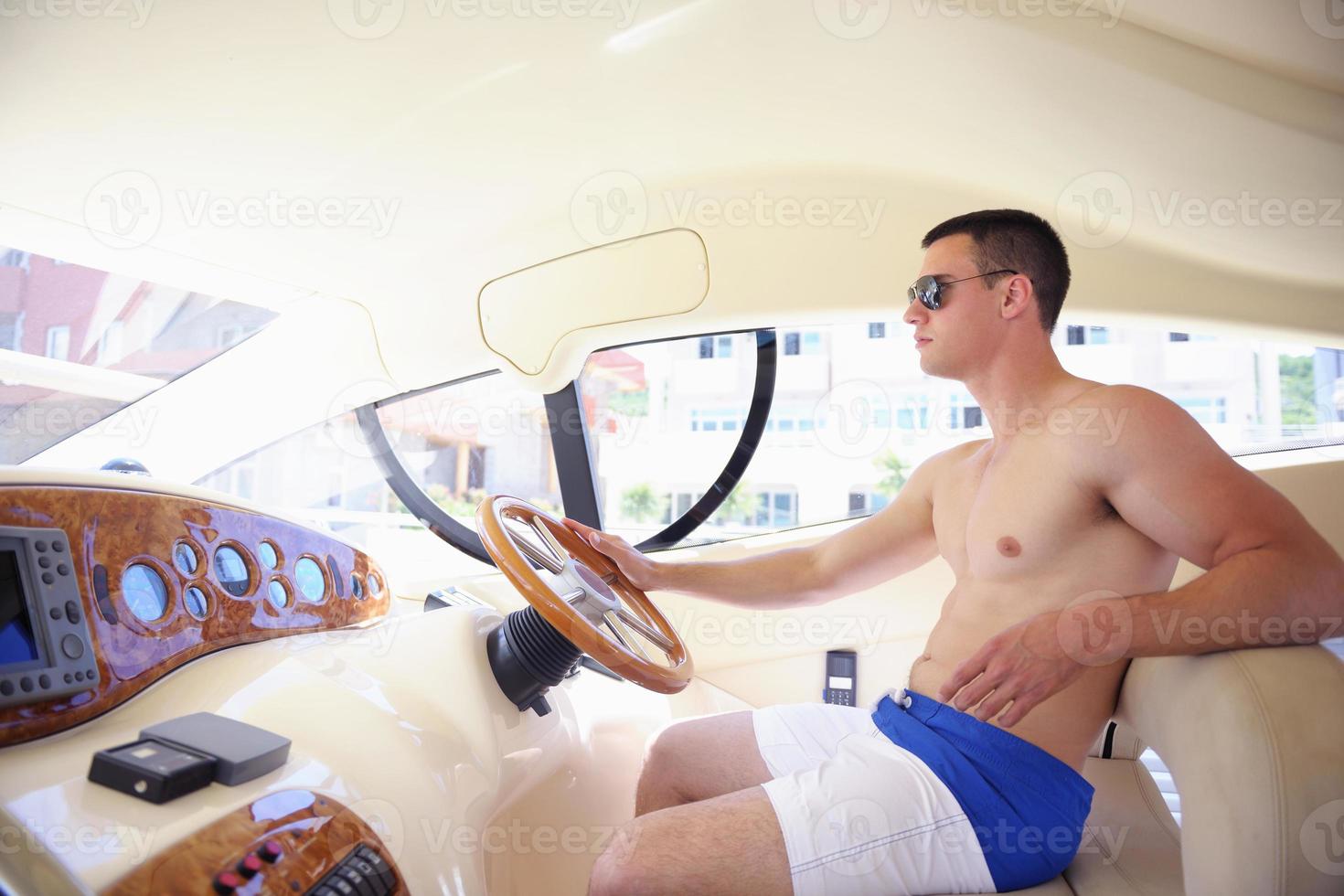 young man on yacht photo
