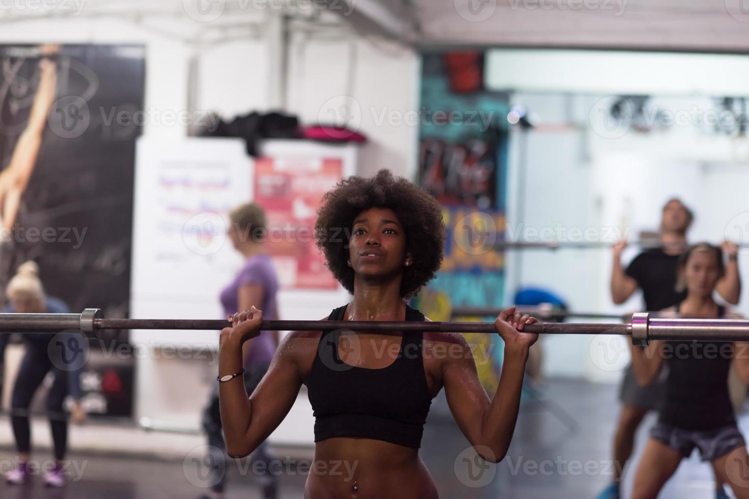 black woman lifting empty bar 11258614 Stock Photo at Vecteezy