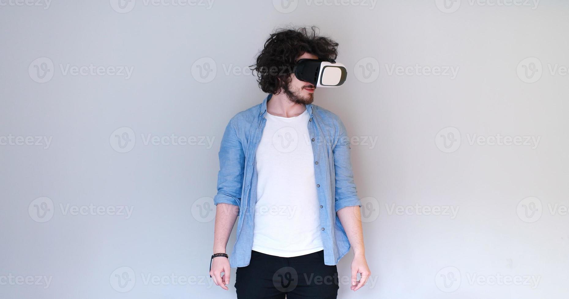 Man using headset of virtual reality photo