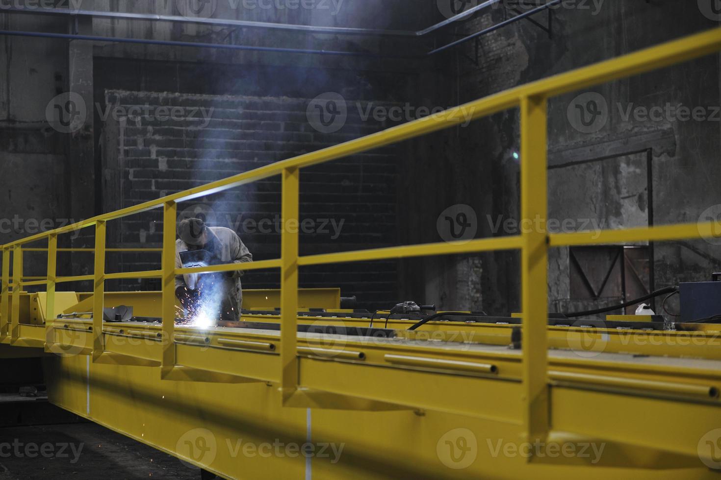 welder working indoors photo