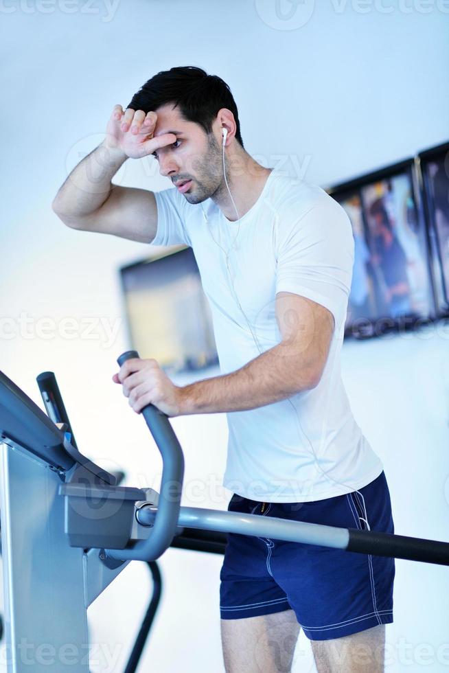 man running on the treadmill photo