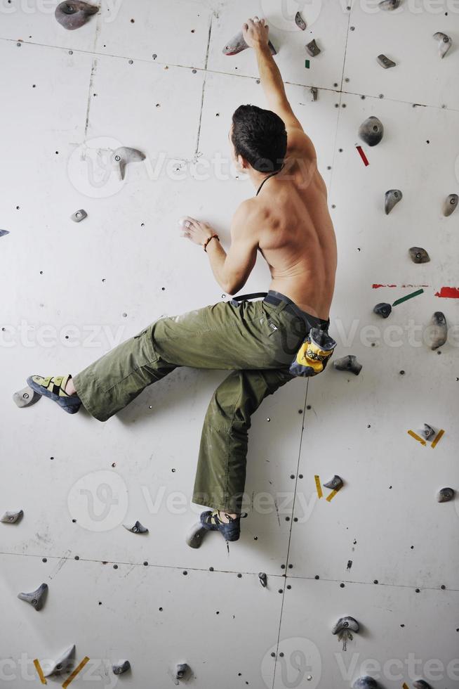 Man rock climbing photo