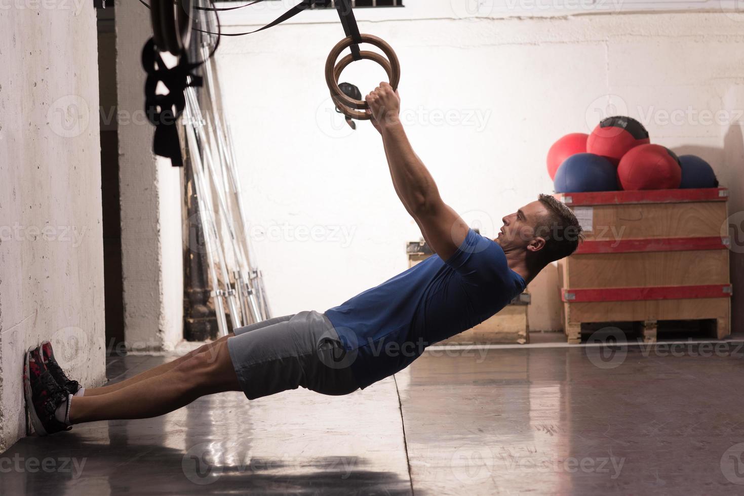man doing dipping exercise photo