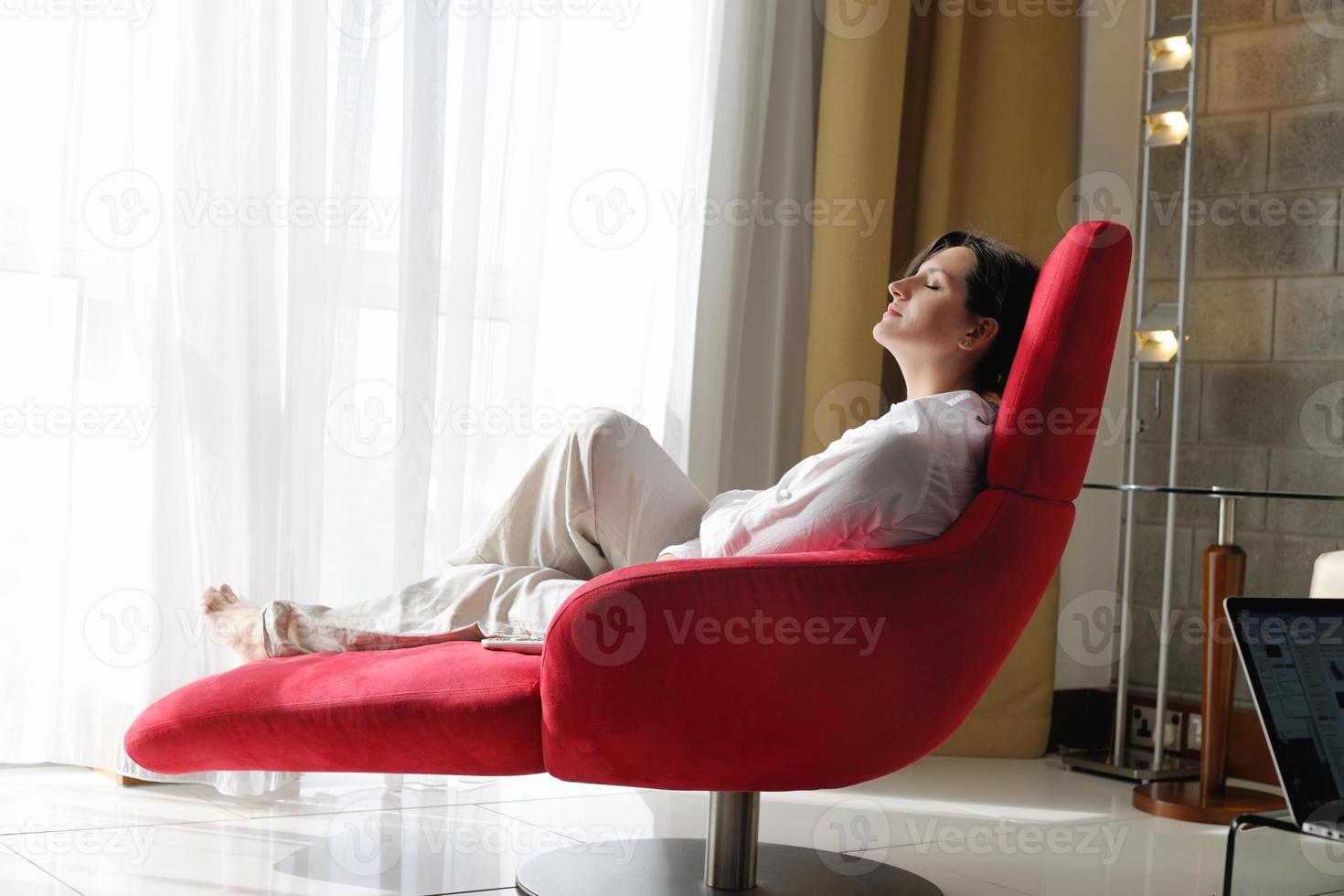 happy young woman relax at home on sofa photo