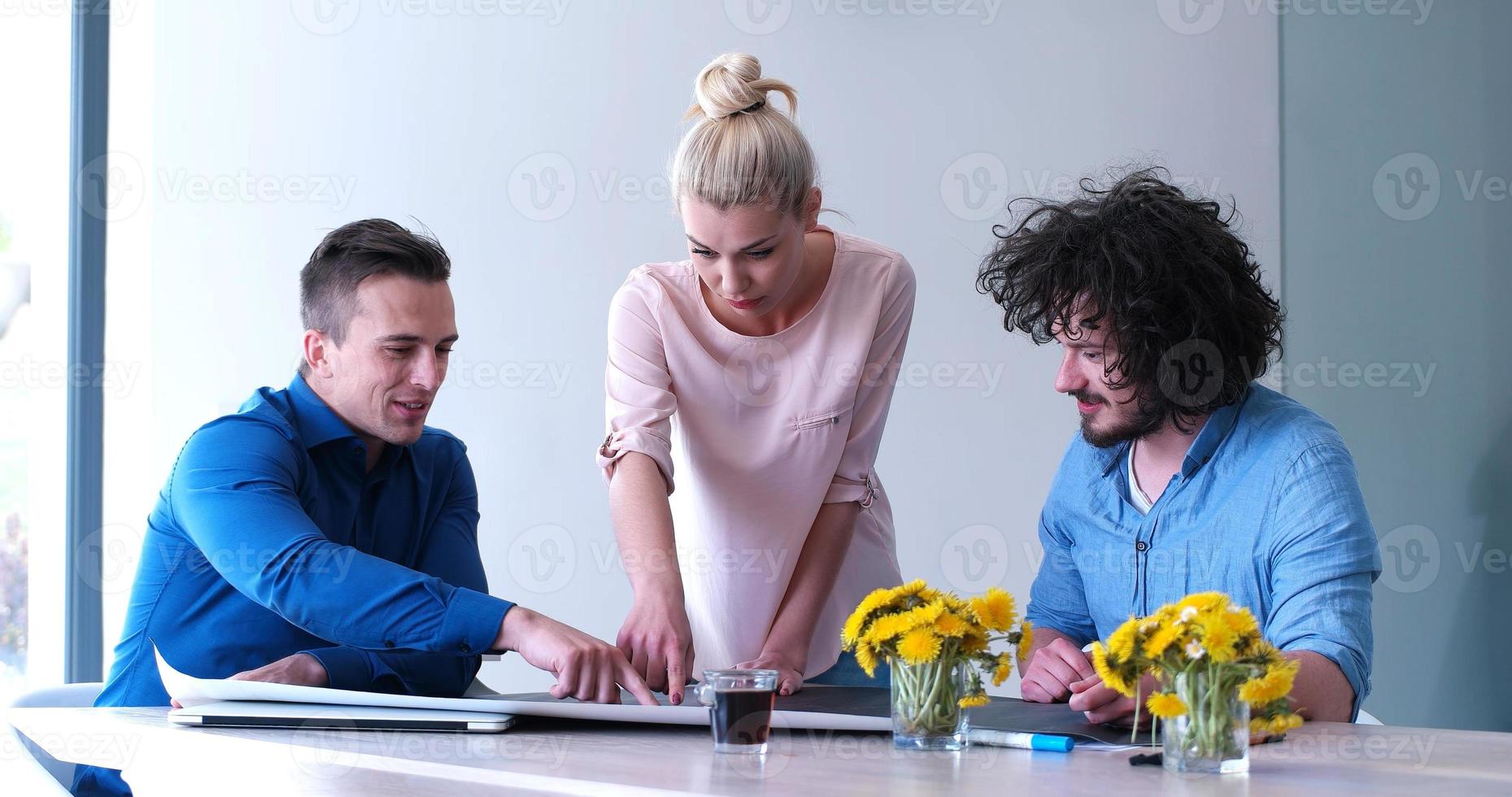 Startup Business Team At A Meeting at modern office building photo