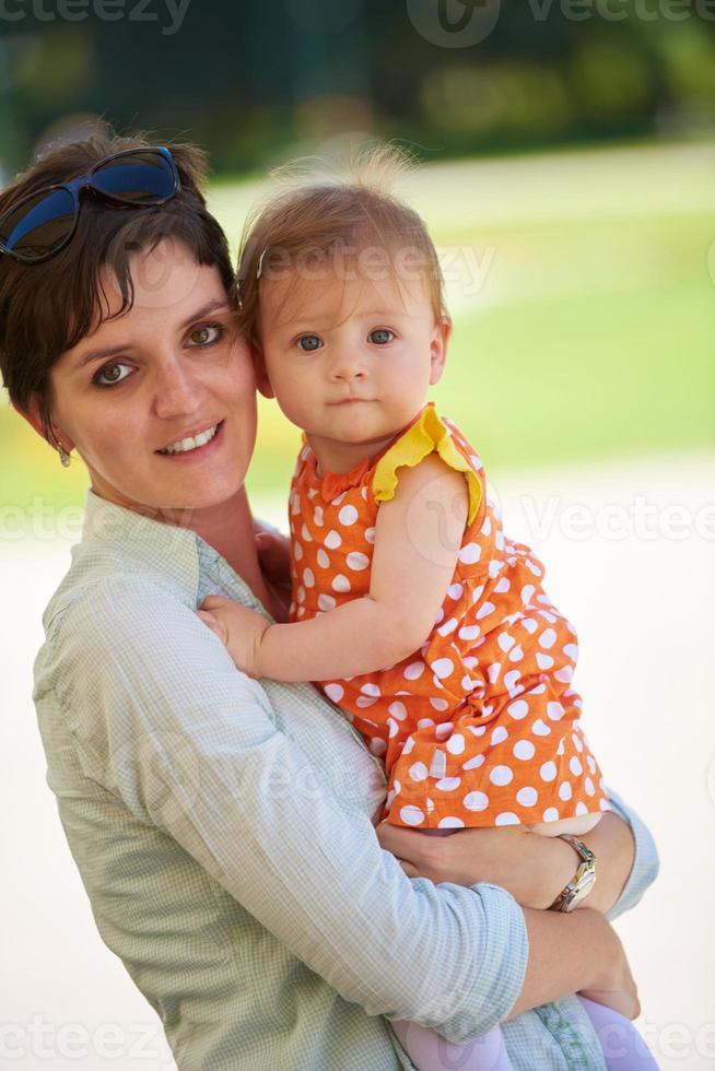 mother and baby in park photo