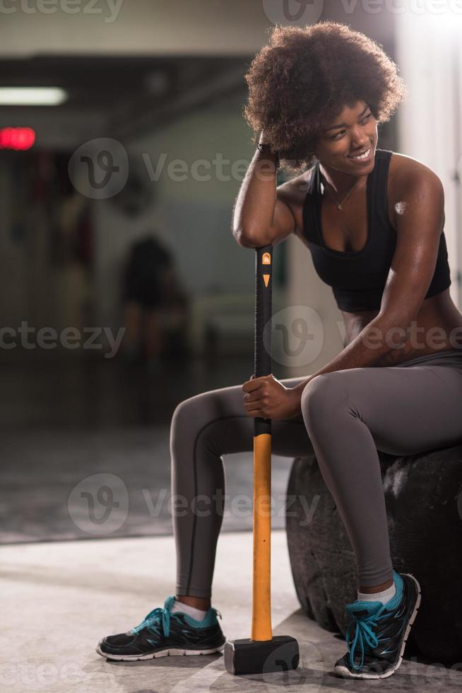 black woman after workout with hammer photo