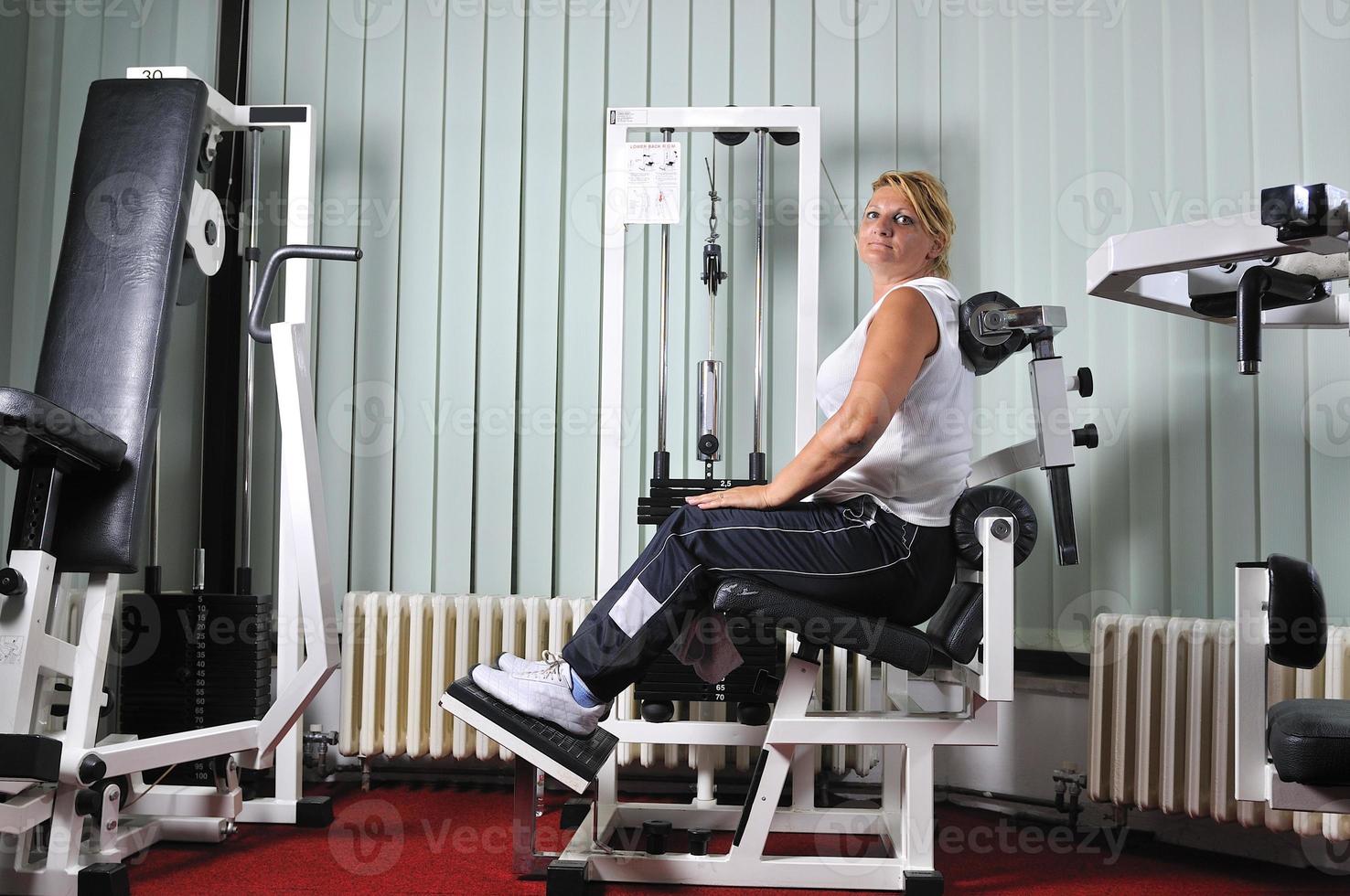 Mature  woman work out in fitness photo