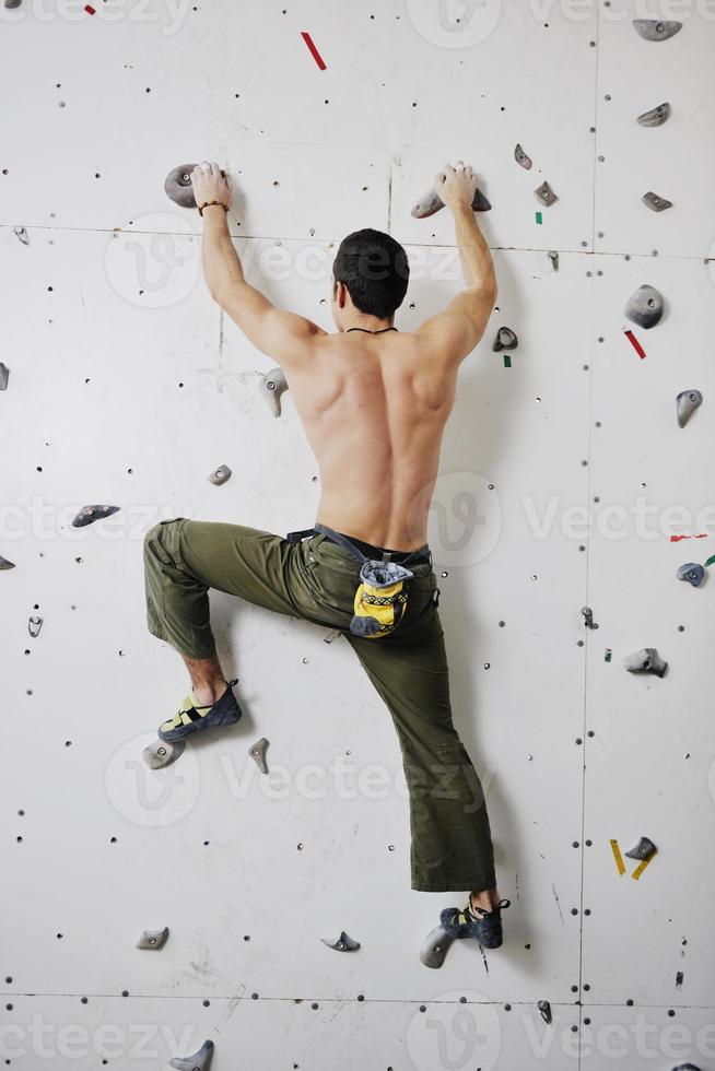 Man rock climbing photo